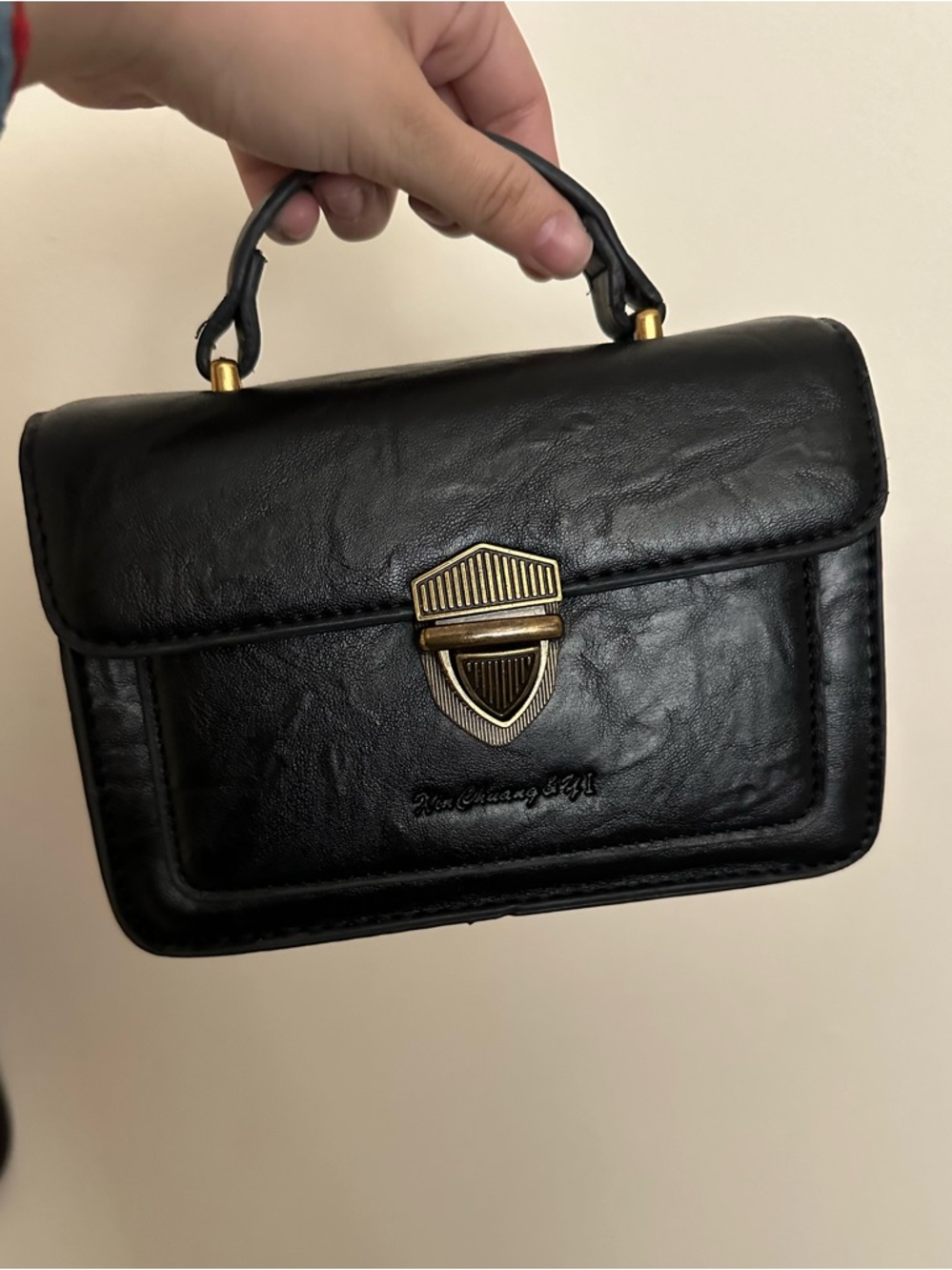 Structured Black Mini Top-Handle Bag with Gold Accent